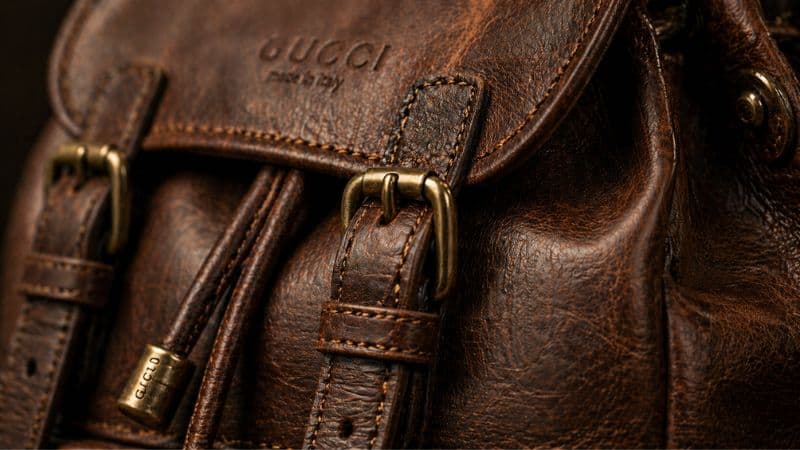 leather backpack stitching brass hardware detail